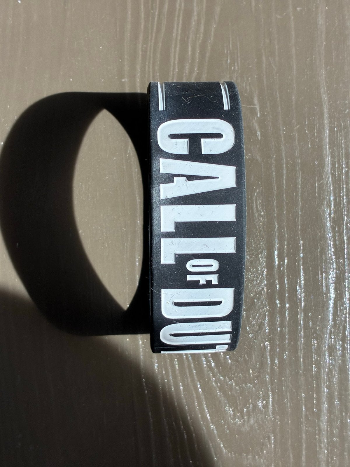 Call of Duty Polsband - Zwart met Wit Logo, Sieraden, Tassen en Uiterlijk, Armbanden, Ophalen of Verzenden, Gebruikt, Zwart, Kunststof of Plastic