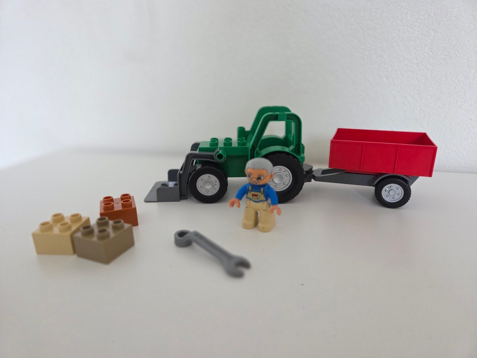 Nette set Lego Dulpo 4687 Tractor met aanhangwagen, laadscho, Ophalen of Verzenden, Zo goed als nieuw, Compleet, Duplo