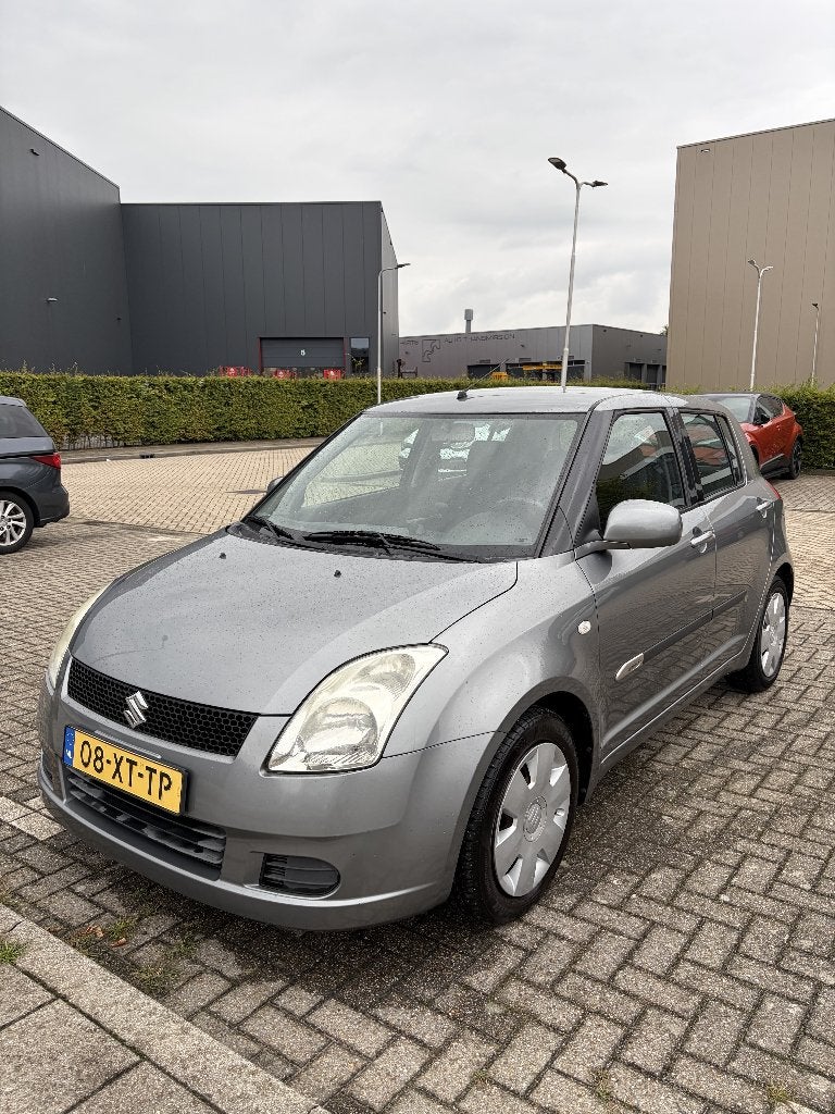 Suzuki Swift 1.5 5D AUT 2007 Grijs Nieuw APK 2027 - 2 Sleute, Auto's, Suzuki, Stof, Zwart, 4 cilinders, Swift