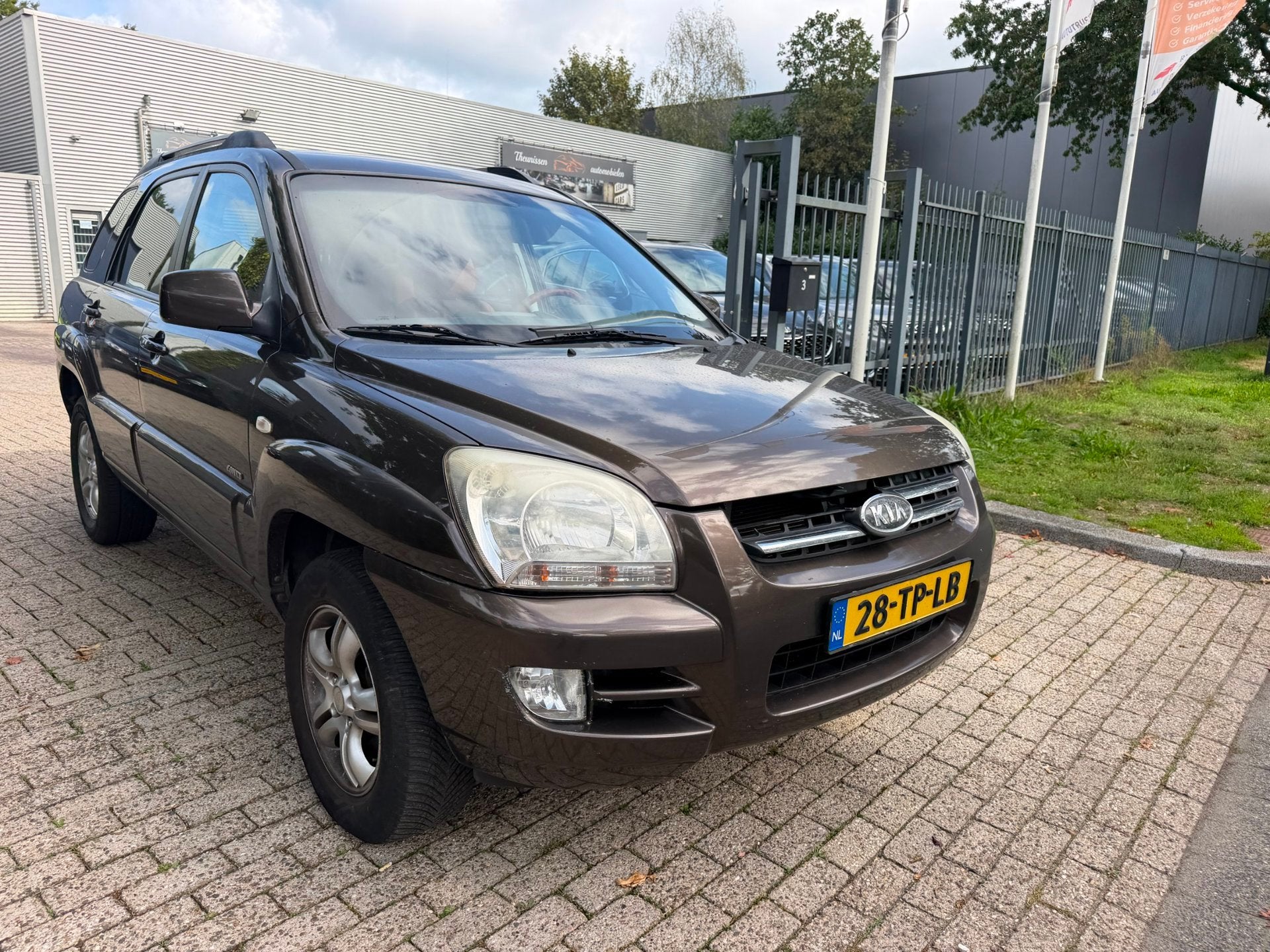 Kia Sportage 2.7 V6 M-bition 4WD 235.603 km rijd perfect net, Auto's, Automaat, Gebruikt, Bruin, 2656 cc