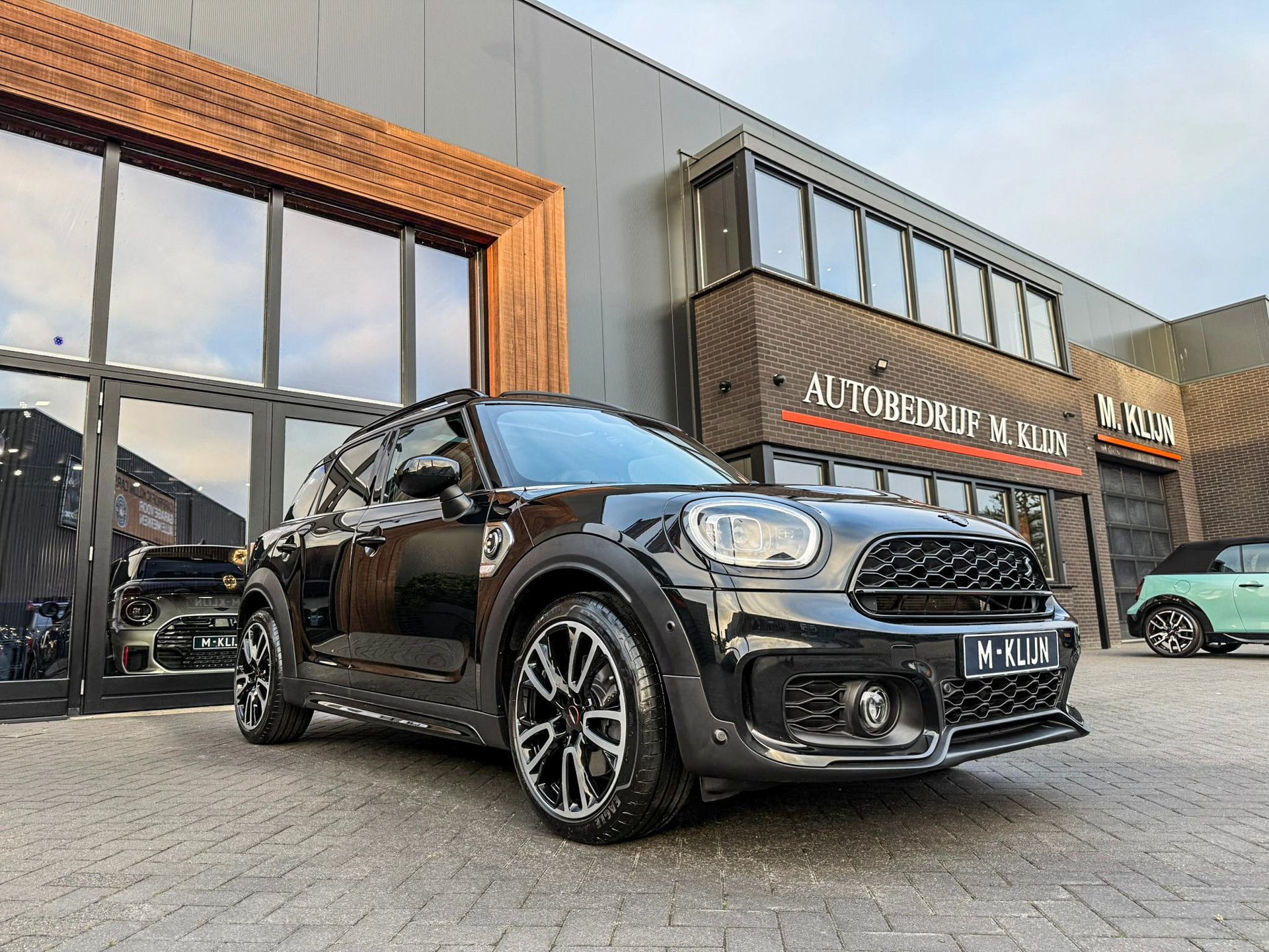 MINI Countryman 1.5 Cooper S E ALL4 John Cooper Works 220pk/, Auto's, Mini, Automaat, Dealer onderhouden, Countryman, Met garantie (alle)