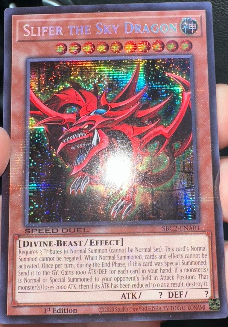 Yu-Gi-Oh! Slifer the Sky Dragon SBC2 1st Edition Duel Promo, Ophalen of Verzenden, Zo goed als nieuw, Losse kaart, Foil