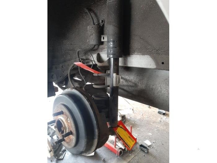Schokdemperpoot links-achter van een Chevrolet Aveo, Gebruikt, -, Ophalen of Verzenden, -