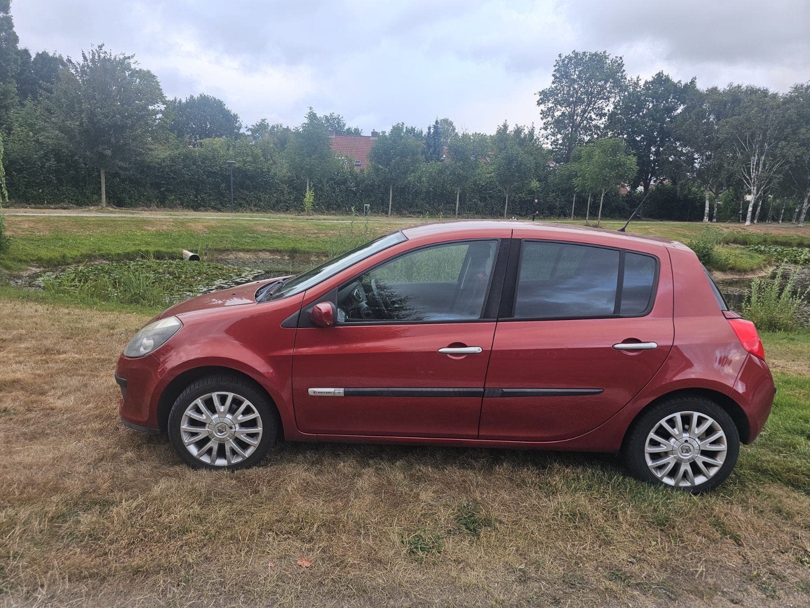 Renault Clio Rip-Curl 1.2 16V 55KW 5-DRS E4 2007 Rood, Auto's, Voorwielaandrijving, 535 kg, 74 pk, 4 cilinders