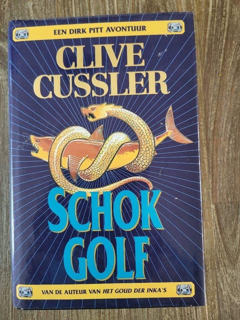 Schokgolf - Clive Cussler, Boeken, Ophalen of Verzenden, Zo goed als nieuw, Clive Cussler