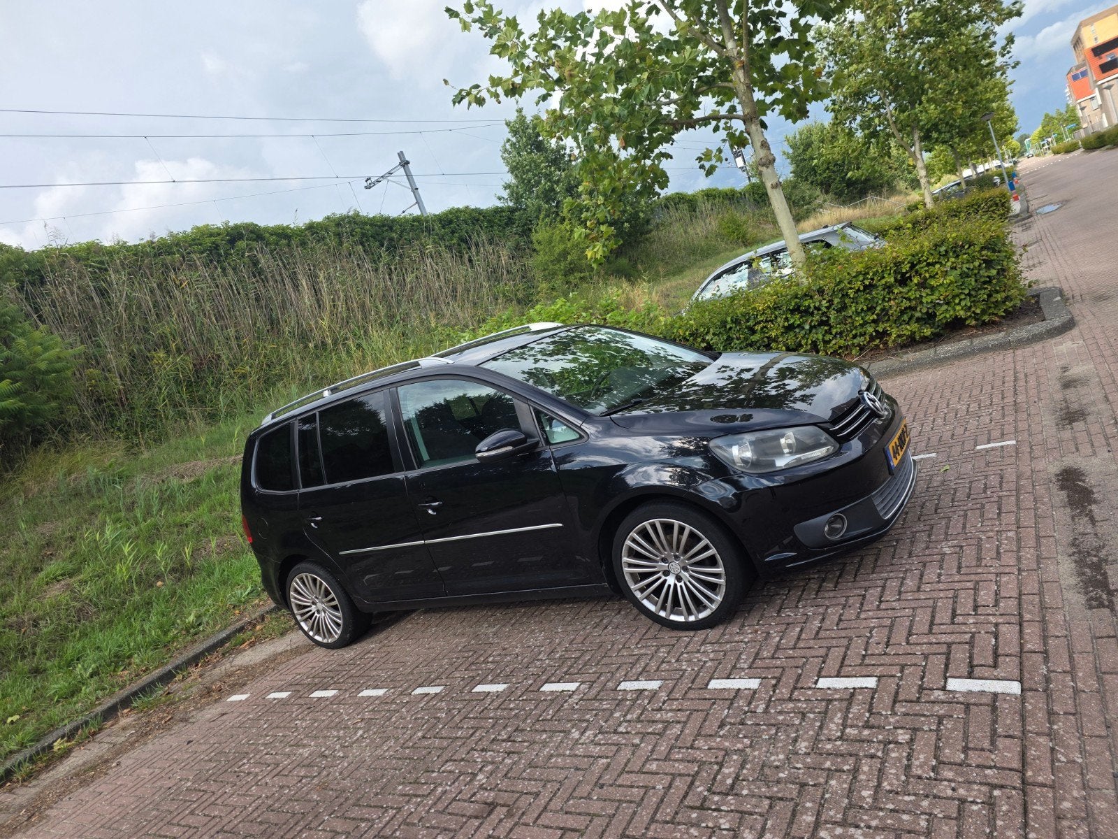 Volkswagen Touran 1.4 TSI 103KW DSG 5P 2010 Zwart, 4 cilinders, 1436 kg, Zwart, Origineel Nederlands