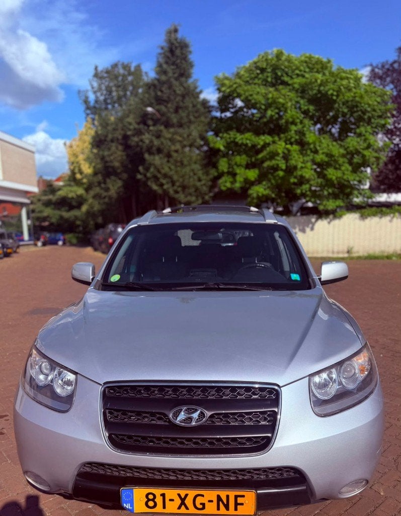 Hyundai Santa Fe 2.7 2WD 7-ST 2007 Grijs, Auto's, Voorwielaandrijving, 2000 kg, Metallic lak, Bedrijf
