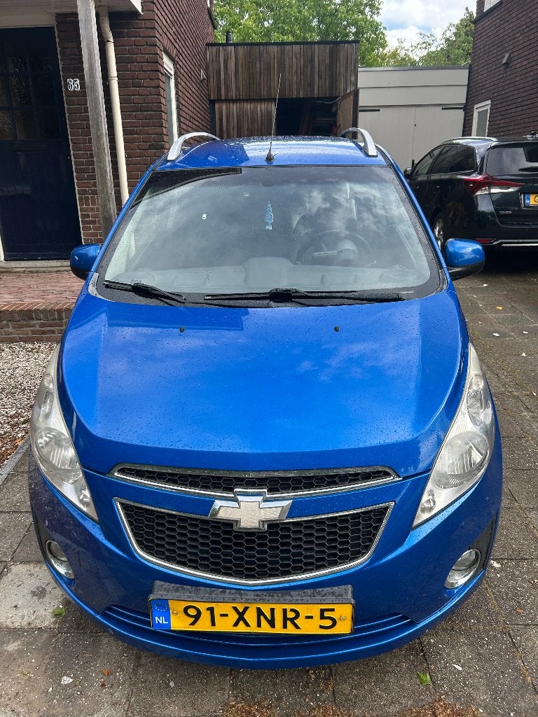 Chevrolet Spark 1.0 Bifuel 2012 Blauw, Auto's, 37 €/maand, 4 cilinders, Blauw, Origineel Nederlands