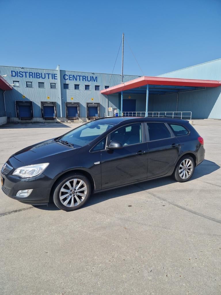 Opel Astra 1.4 Turbo 103KW Sports Tourer 2012 Zwart, Auto's, Voorwielaandrijving, 4 cilinders, Leder en Stof, Zwart