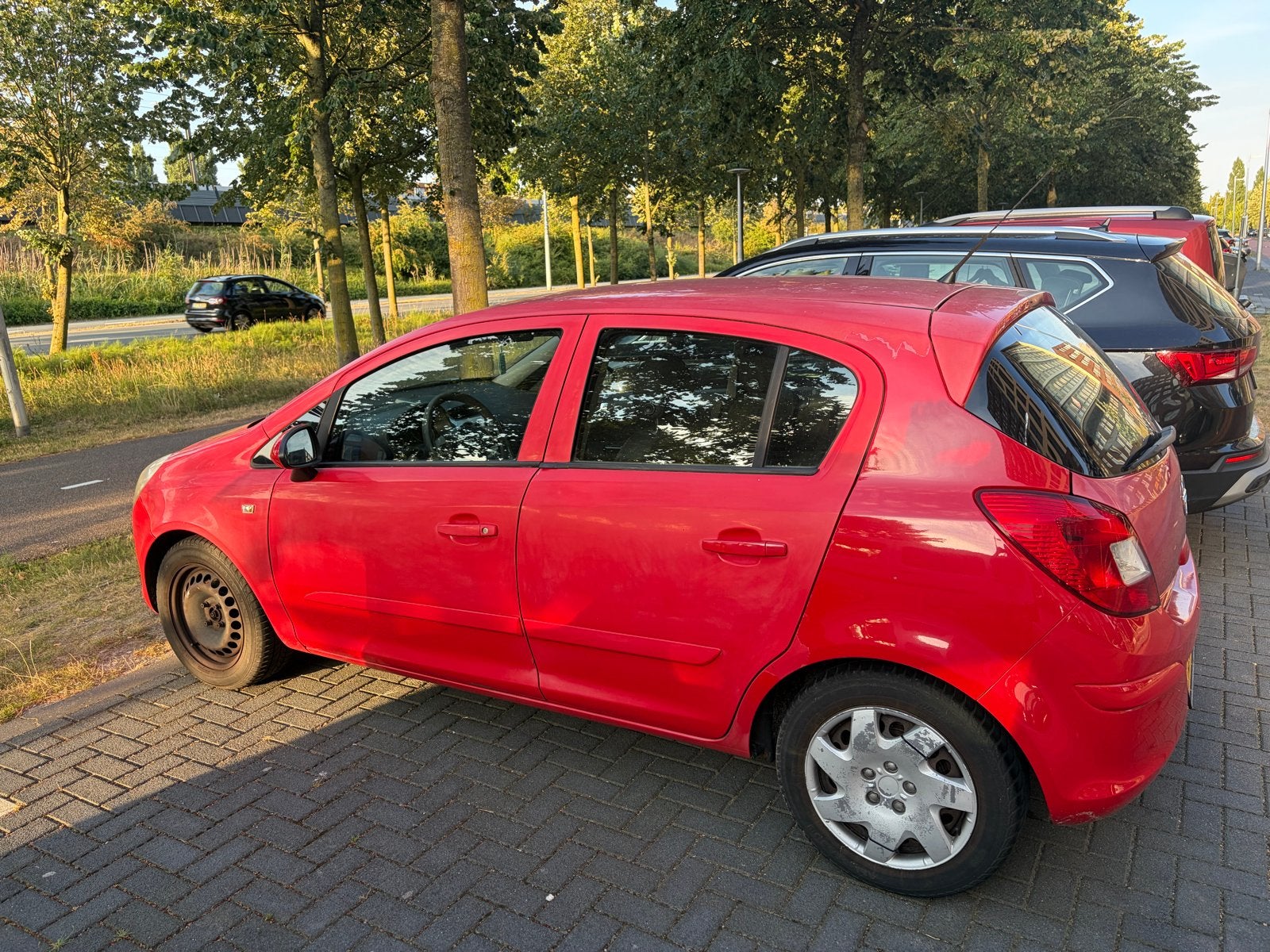Opel Corsa 1.2 16V 5D 2007 Rood, Auto's, Voorwielaandrijving, 4 cilinders, 1229 cc, 49 €/maand