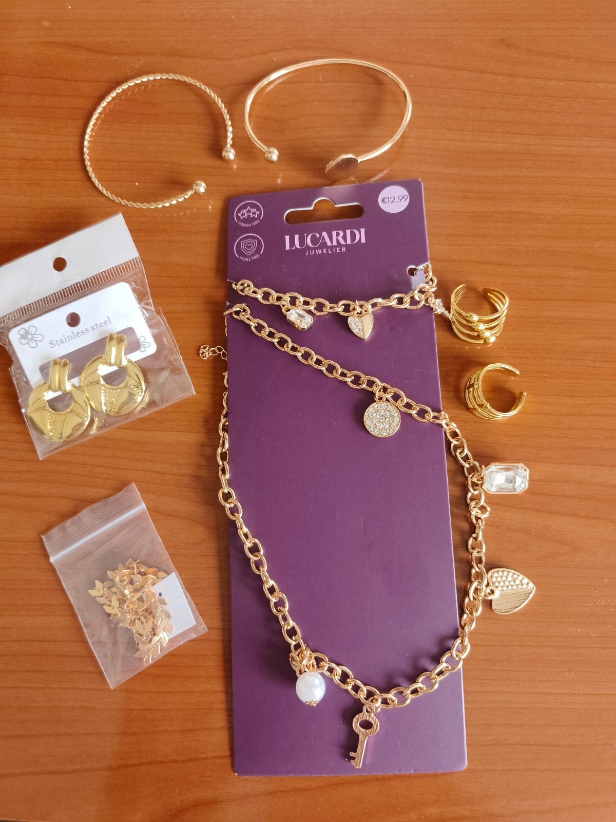 Lucardi Sieraden Set - Goudkleurig en Splinternieuw, Staal, Nieuw, Ophalen of Verzenden, Met bedels of kralen