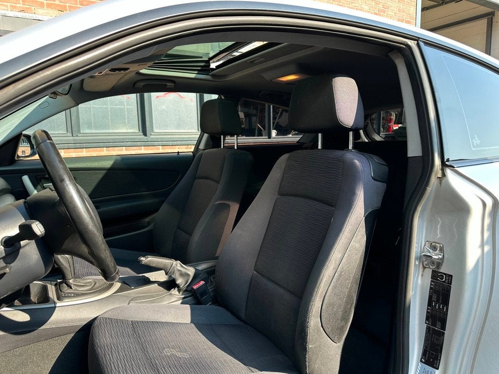 BMW 1-serie 118i|Automaat|Schuifdak|Pdc|xenon|Stoelv.warming, Auto's, BMW, 4 stoelen, 1265 kg, Euro 4, 670 kg
