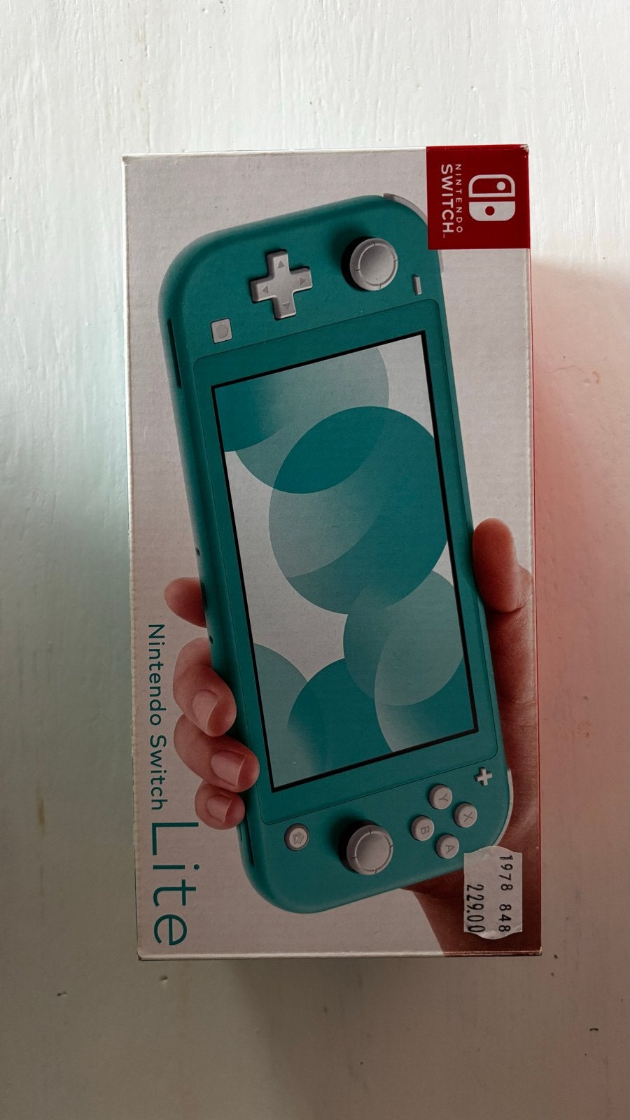Nintendo Switch Lite Blauw met 4 spellen, Spelcomputers en Games, Ophalen of Verzenden, Turquoise, Zo goed als nieuw