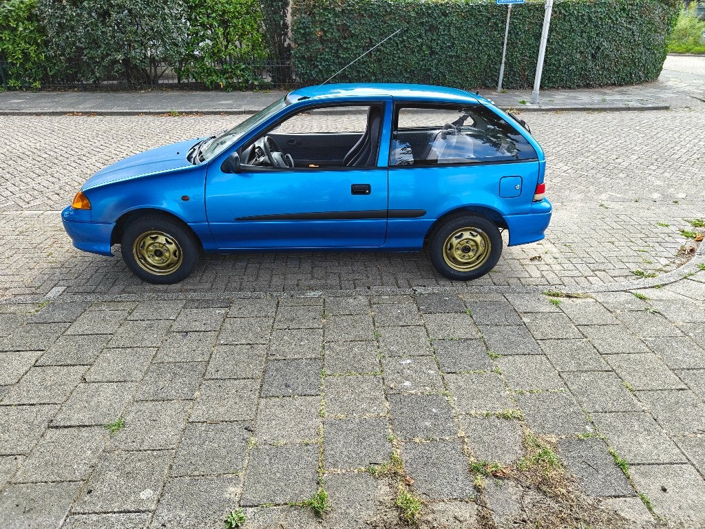 Suzuki Swift 1.3 2002 Blauw, Auto's, Suzuki, Voorwielaandrijving, Stof, 4 cilinders, Blauw
