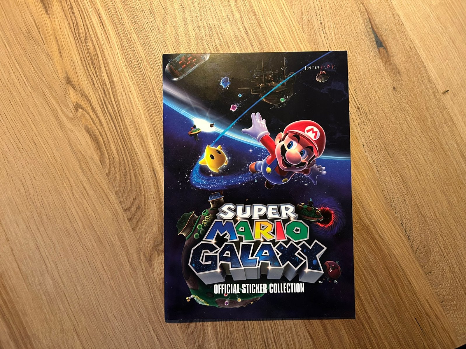 Super Mario Galaxy sticker album van E-max, Ophalen of Verzenden, Zo goed als nieuw