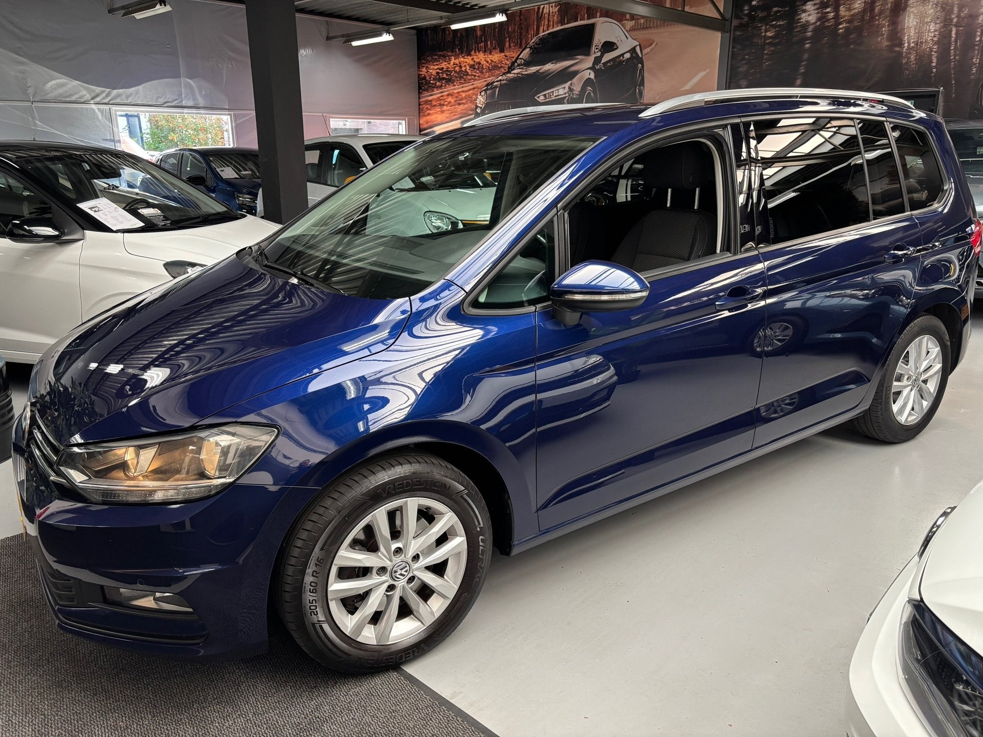 Volkswagen Touran 1.2 TSI Comfortline 7persoons / Navi, Voorwielaandrijving, Gebruikt, 4 cilinders, Met garantie (alle)
