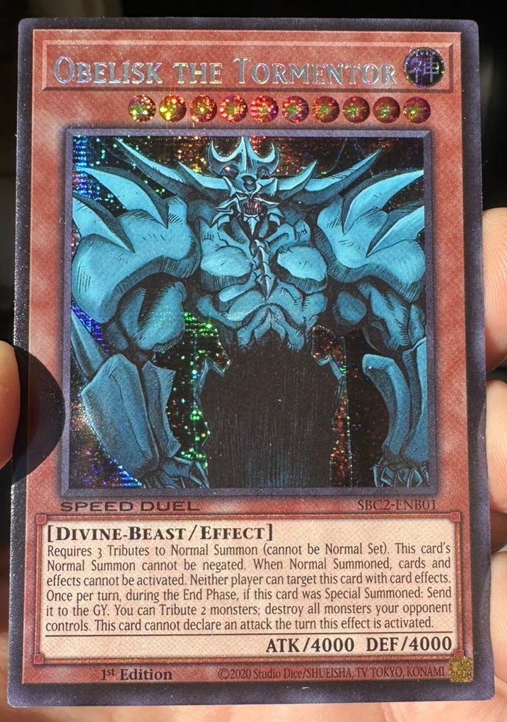 Yu-Gi-Oh! Obelisk the Tormentor SBC2 1st Duel Promo !, Ophalen of Verzenden, Zo goed als nieuw, Losse kaart, Foil