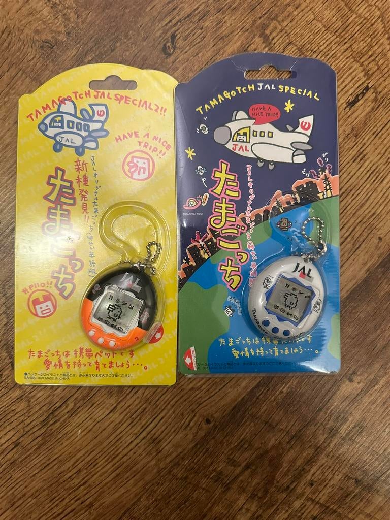 Tamagotchi P1 en P2 JAL speciale Editie Set zeldzaam 1998, Verzamelen, Ophalen of Verzenden, Gebruikt