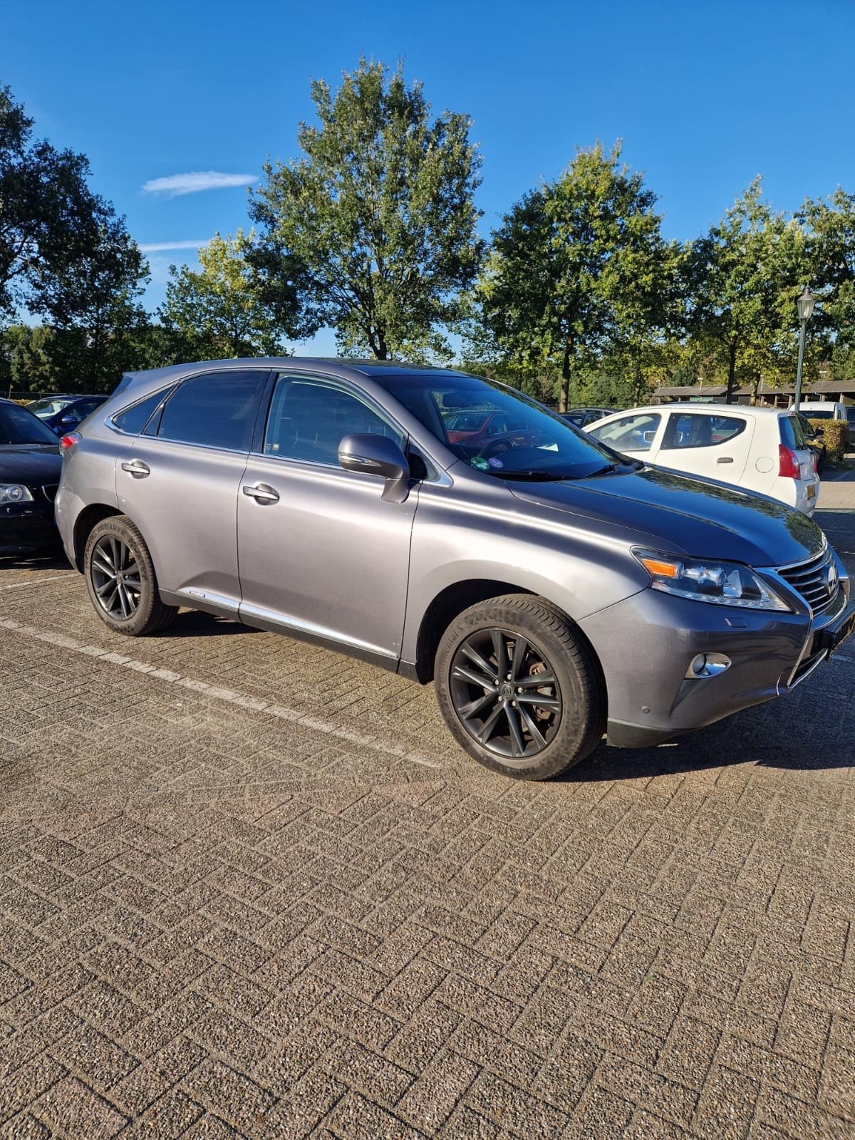 Lexus RX(-H) 450H 3.5 V6 Hybrid CVT 2012 Grijs, Auto's, Automaat, 2000 kg, 138 €/maand, Origineel Nederlands