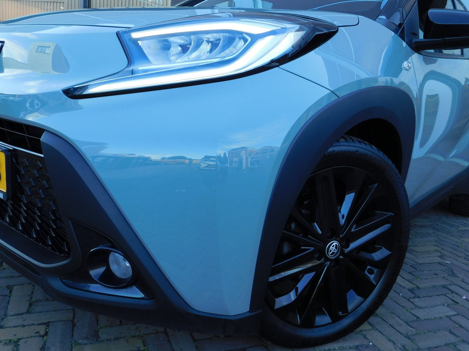 Toyota Aygo X 1.0 VVT-i MT Pulse Design Pack (bj 2024), Auto's, Stof, Gebruikt, Euro 6, 4 stoelen