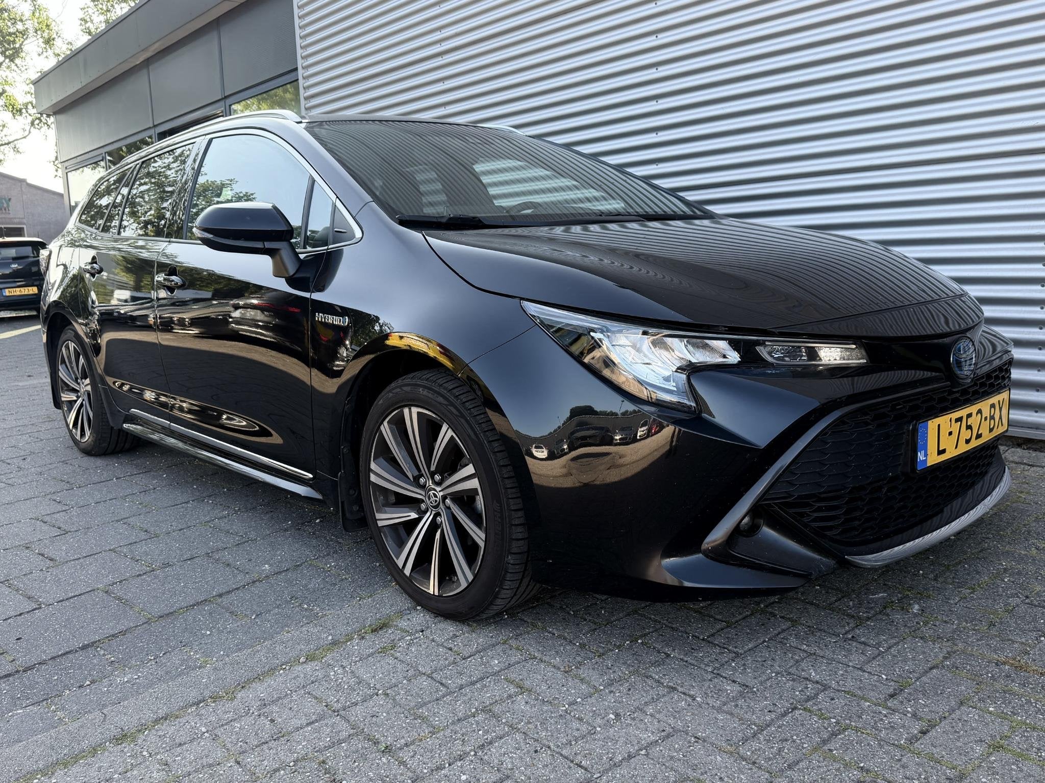 Toyota Corolla Touring Sports 1.8 Hybrid Business Plus, Auto's, Toyota, 1345 kg, 450 kg, Gebruikt, 4 cilinders