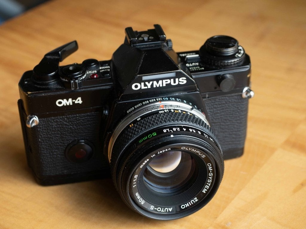 Olympus OM-4 kleinbeeldcamera met extra telelens, Audio, Tv en Foto, Fotocamera's Analoog, Ophalen of Verzenden, Gebruikt, Spiegelreflex