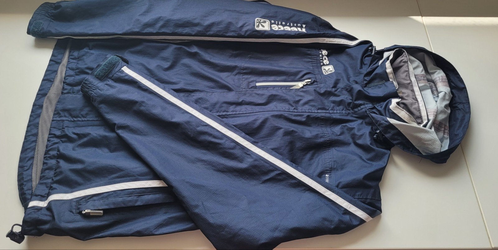 Reece donkerblauw regenpak hockey - dames maat s/m, Ophalen, Gebruikt, Kleding