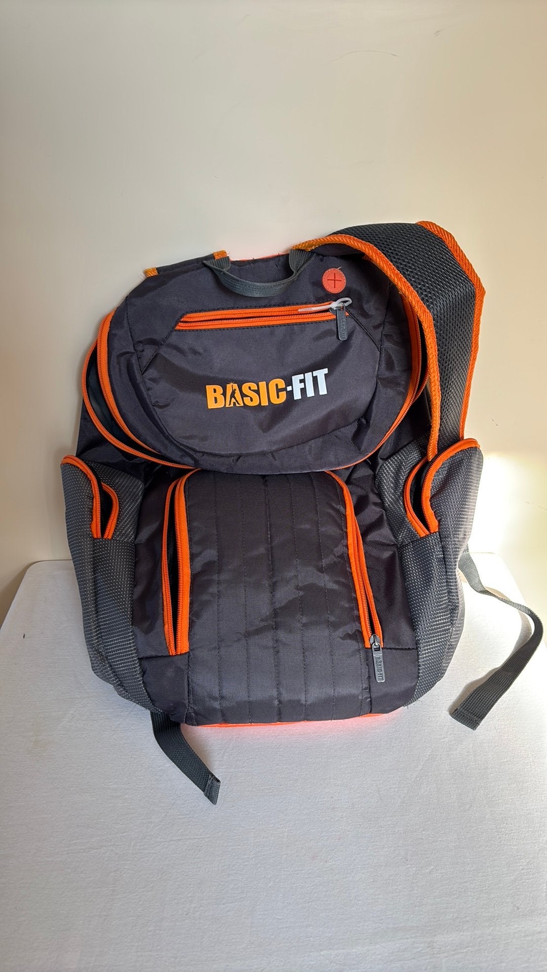 Basic fit rugtas grijs oranje, Sieraden, Tassen en Uiterlijk, Ophalen of Verzenden, Zo goed als nieuw, Overige merken