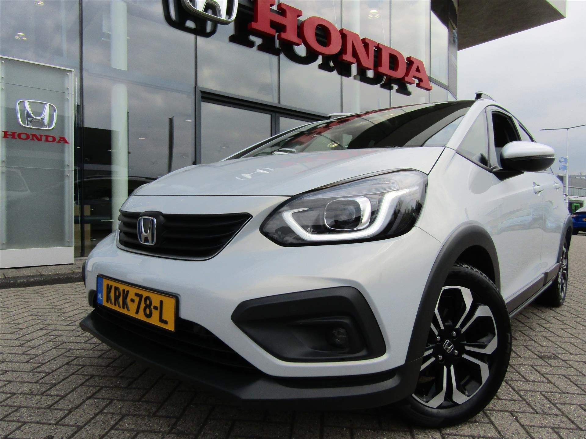 Honda Jazz 1.5 i-MMD 109pk Hybrid CVT Crosstar, Auto's, Stof, 4 cilinders, Wit, 98 pk