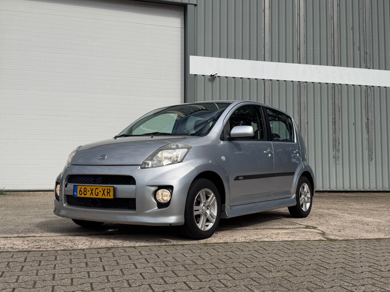 Daihatsu Sirion 1.3 Comfort Sport 2007 Grijs, Voorwielaandrijving, Stof, 4 cilinders, Parkeersensor