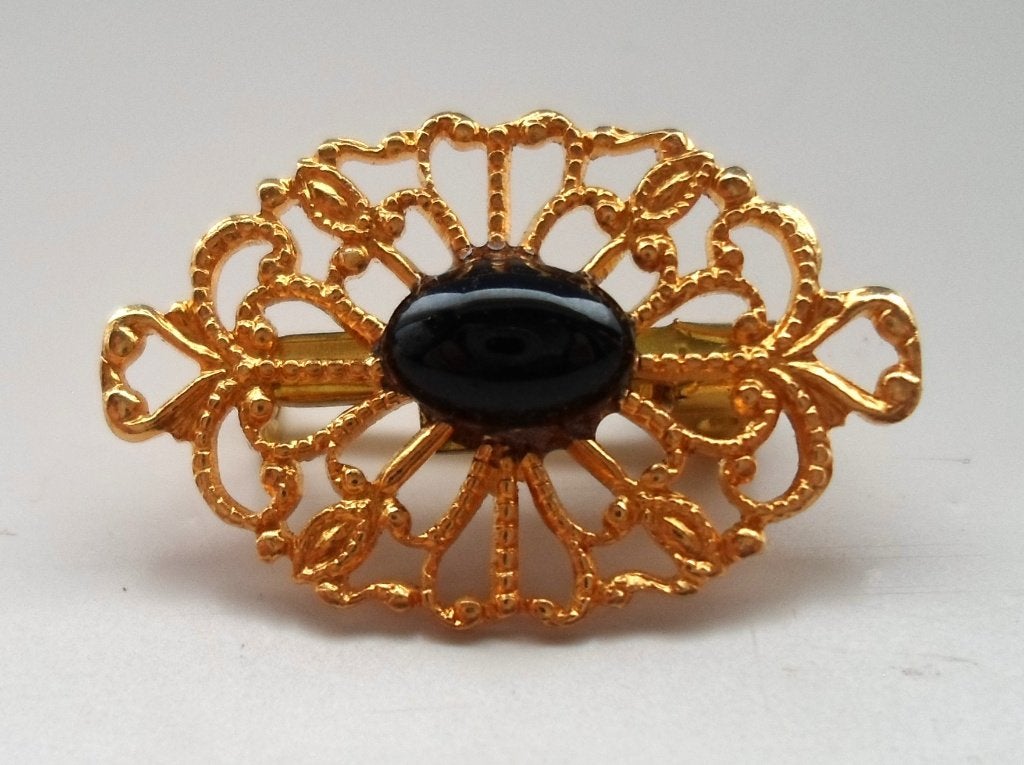 Broche. Goudkleurig met zwarte steen., Sieraden, Tassen en Uiterlijk, Broches, Zo goed als nieuw, Overige materialen, Goud, Ophalen of Verzenden