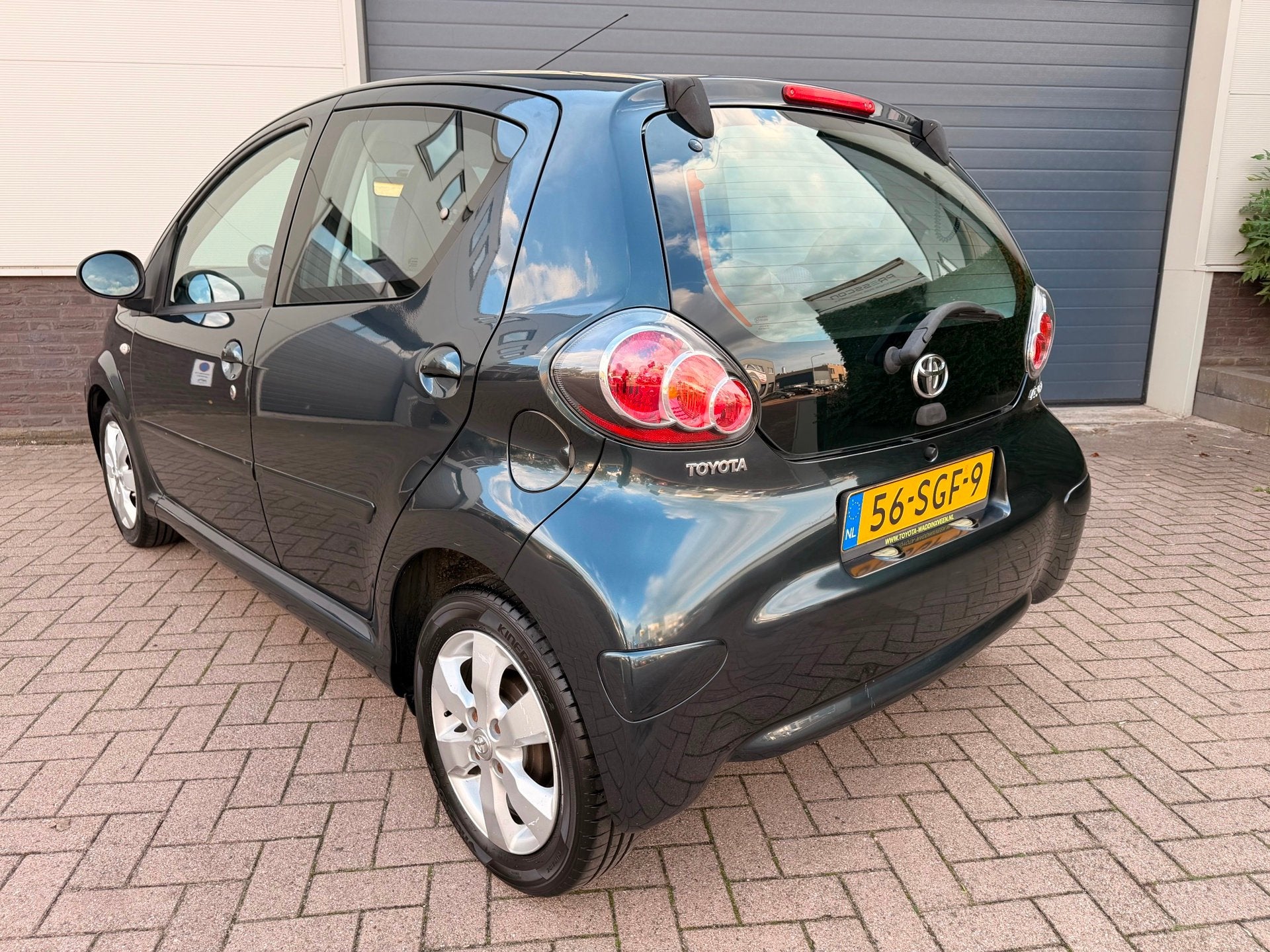 Toyota Aygo 1.0-12V Aspiration Green Navigator/Airco/Leder/N, Auto's, Voorwielaandrijving, Euro 5, Gebruikt, 4 stoelen
