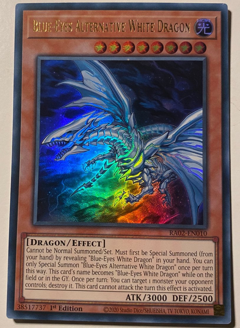 Yu-Gi-Oh! Blue-Eyes Alternative White Dragon RA02 1st !, Ophalen of Verzenden, Zo goed als nieuw, Losse kaart, Foil