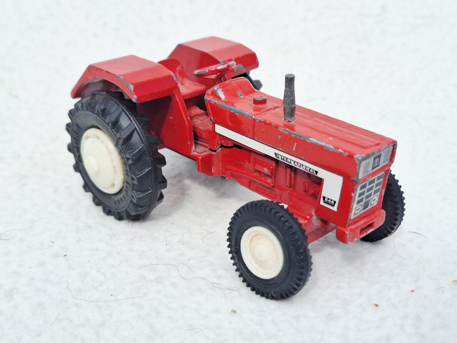 Vintage International 844 Tractor model, Ophalen of Verzenden, Gebruikt, Tractor of Landbouw, Overige merken