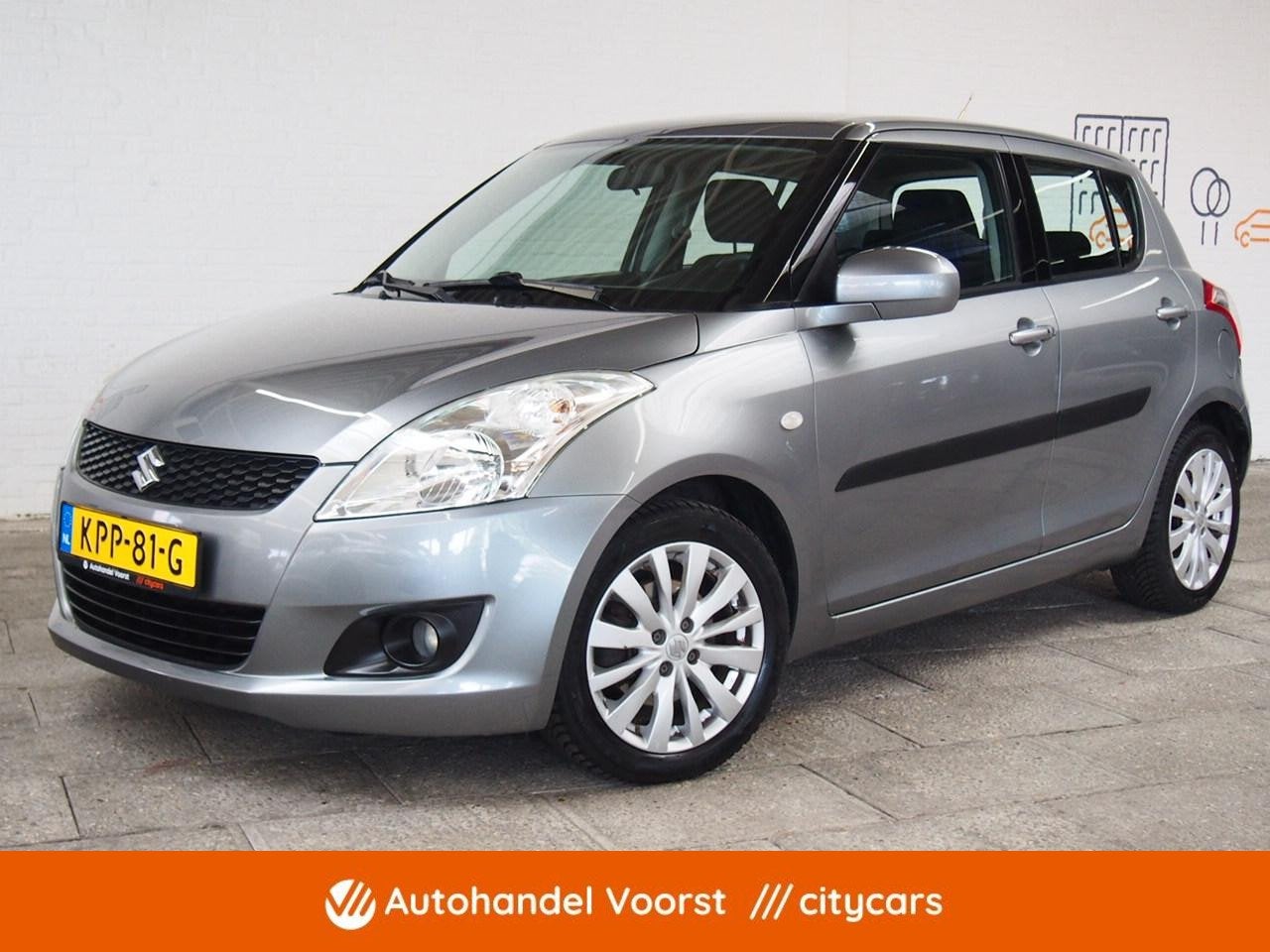 Suzuki Swift 1.2 Exclusive EASSS Cruise Keyless (APK:Nieuw), Auto's, Suzuki, Voorwielaandrijving, Euro 5, Stof, Gebruikt