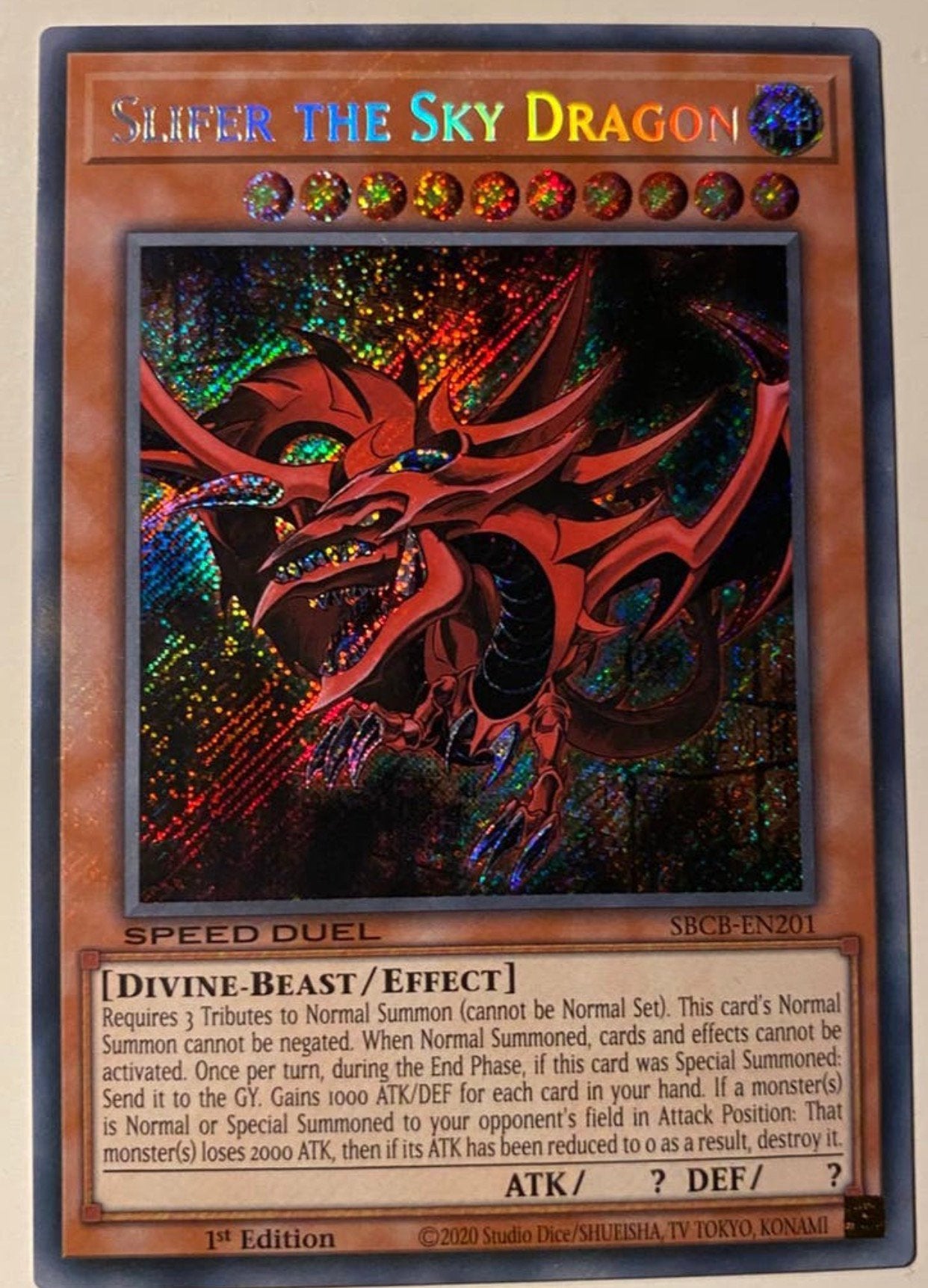 Yu-Gi-Oh! Slifer the Sky Dragon SBCB 1st Edition !, Ophalen of Verzenden, Zo goed als nieuw, Losse kaart, Foil