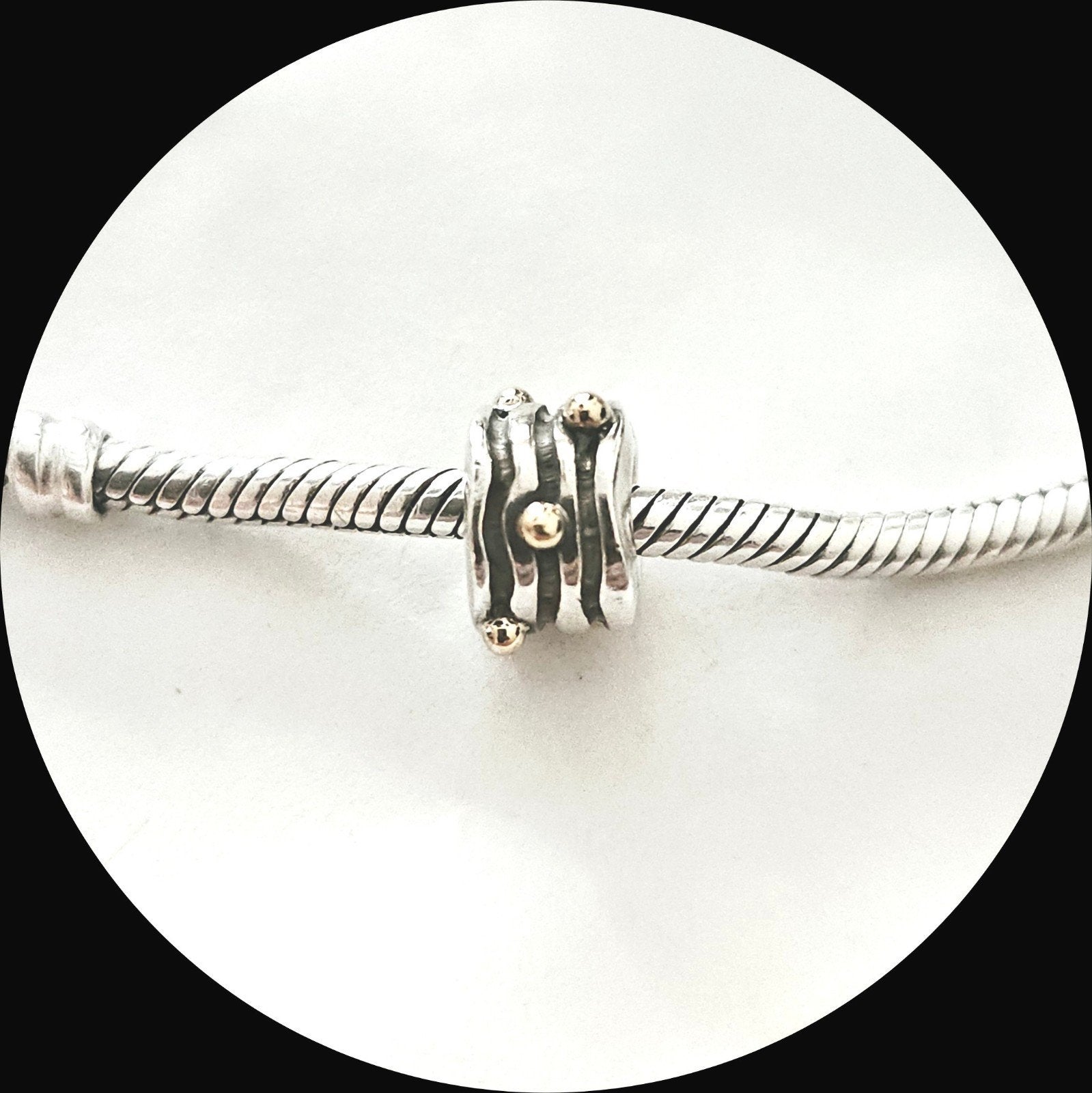 Pandora Golvende Lijnen met gouden Bolletjes 790167 / retire, Pandora, Ophalen of Verzenden, Zo goed als nieuw, 1 bedel