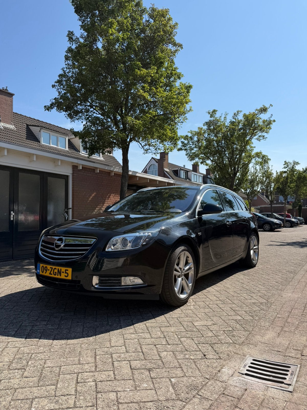 Opel Insignia 2.0 Turbo 220 pk Sports Tourer 2010 Zwart, Auto's, Voorwielaandrijving, 1998 cc, 4 cilinders, Zwart