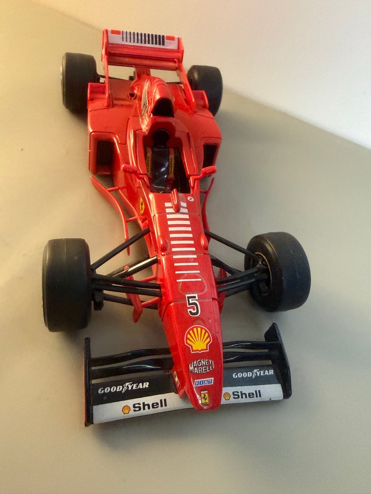 Bburago Ferrari F310B F1 Michael Schumacher 1:24 (1997), Ophalen of Verzenden, Gebruikt, Auto, Bburago