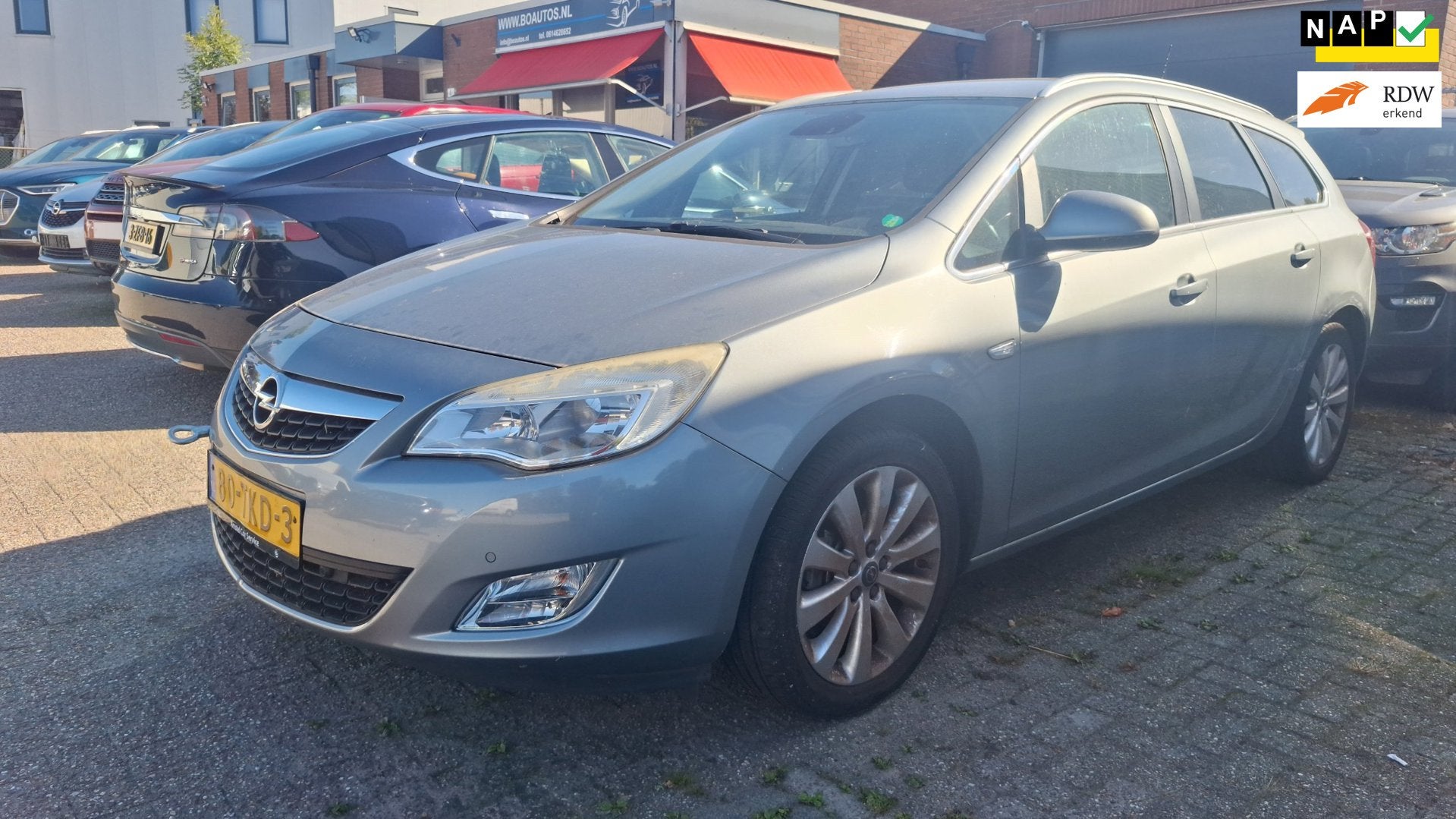 Opel Astra Sports Tourer 1.4 Turbo Cosmo, Auto's, Voorwielaandrijving, Euro 5, Gebruikt, 4 cilinders