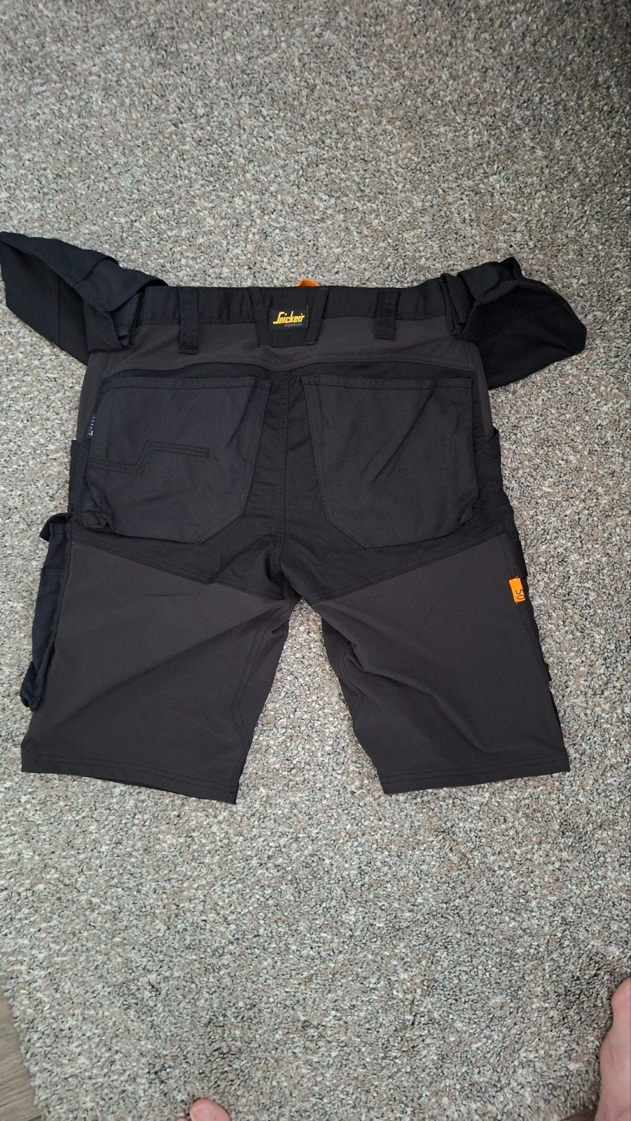 korte werkbroek zwart, Ophalen