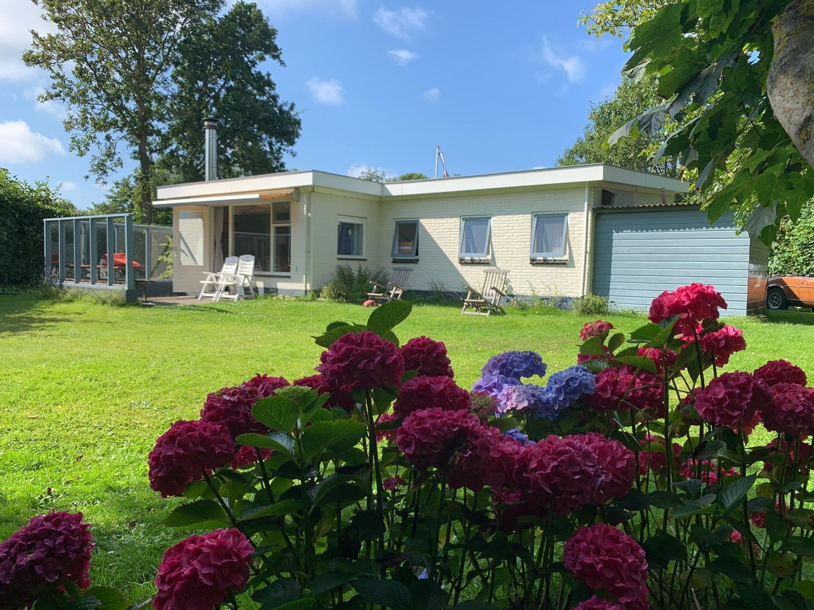 Te huur 4/6 persoons huisje op Texel, Vakantie, Tuin