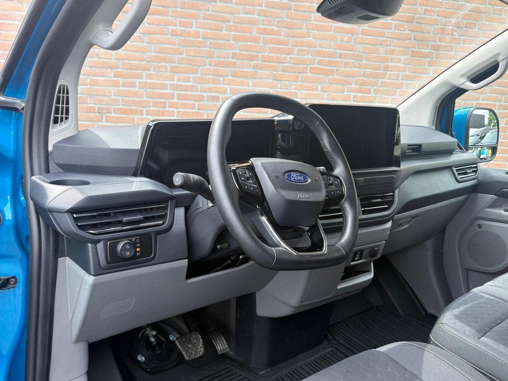Ford E-Transit Custom 340 Lang 218PK Limited / 2.300KG Trekh, Auto's, Bestelauto's, Automaat, Gebruikt, Met garantie (alle), Blauw