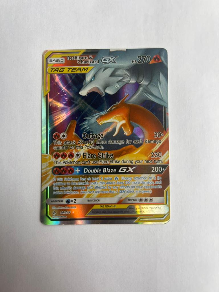 Reshiram & Charizard GX TAG TEAM, Hobby en Vrije tijd, Verzamelkaartspellen | Pokémon, Ophalen of Verzenden, Zo goed als nieuw