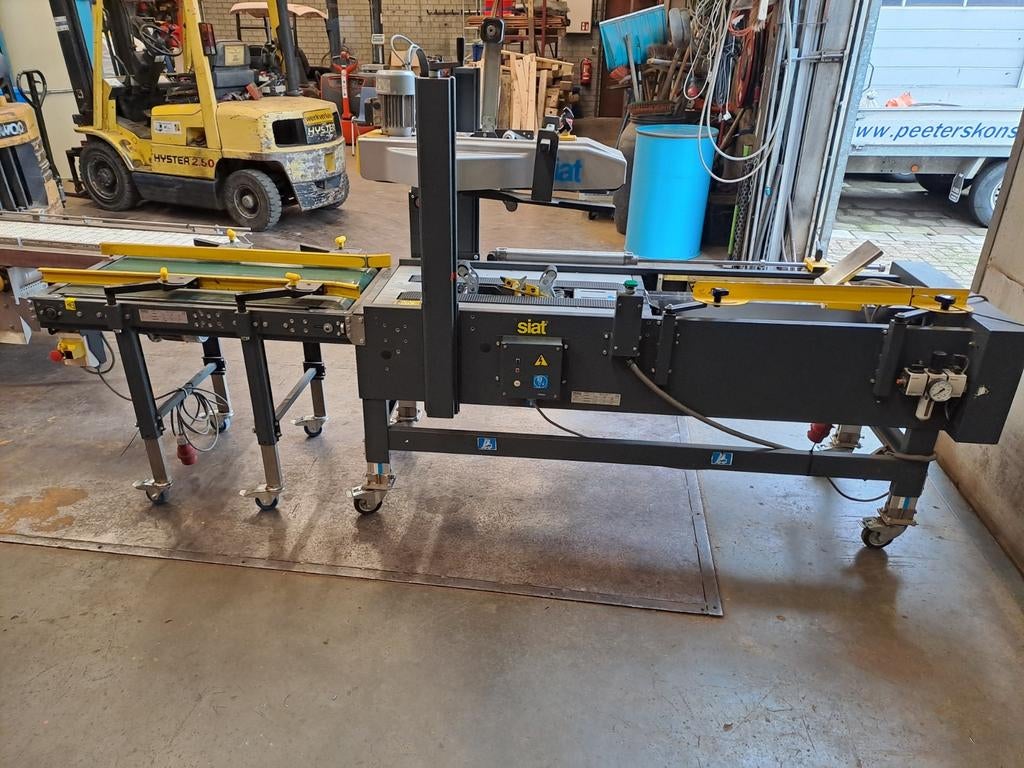 SIAT Dozensluitmachine met Transportband, Ophalen