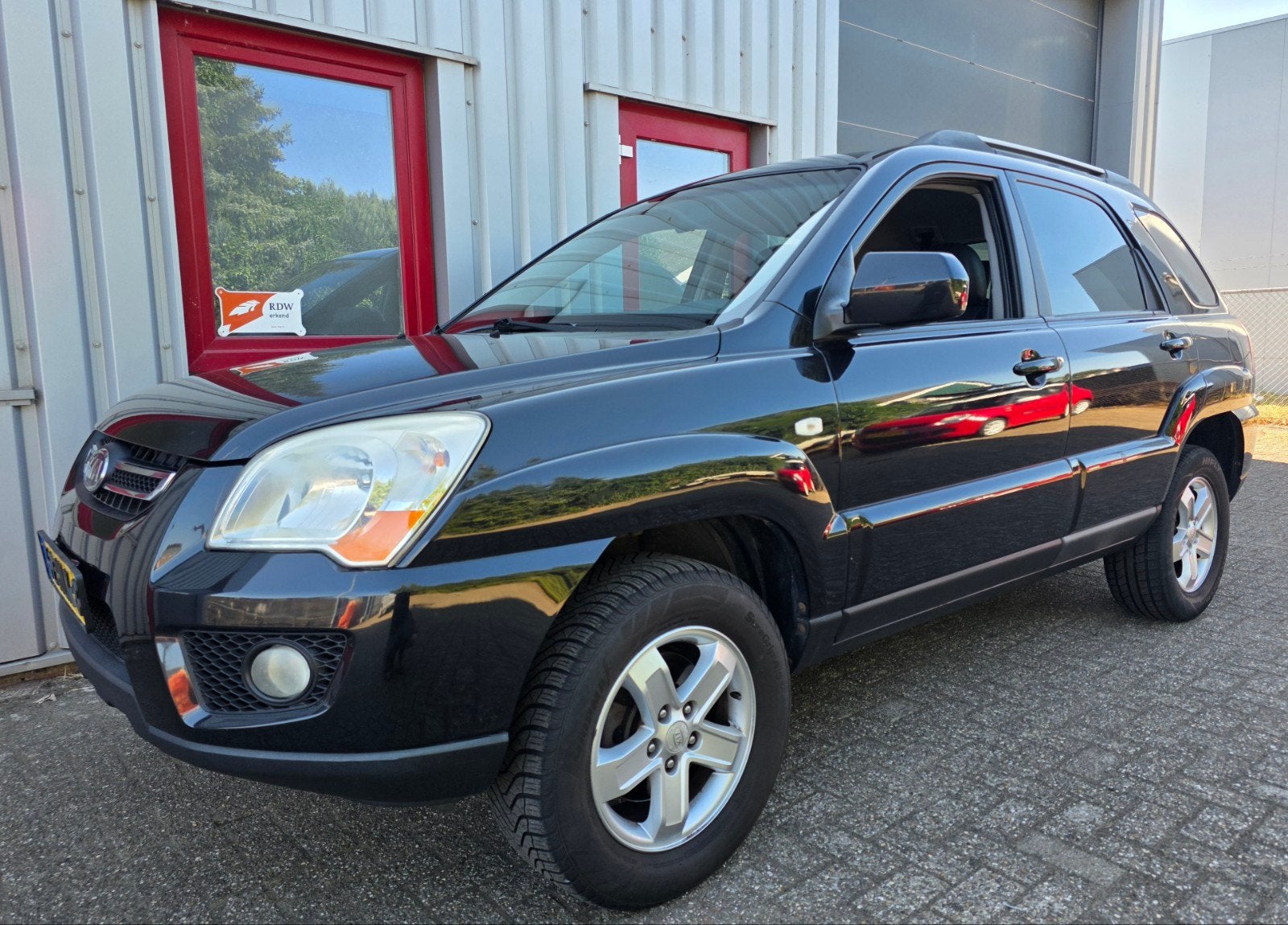 ✅ Kia Sportage 2.0 2009, Climate, Leder, Trekhaak, APK, NAP, 1442 kg, Zwart, 4 cilinders, Zwart