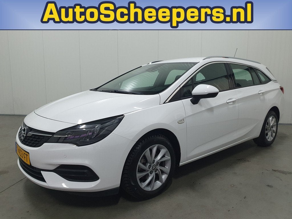 Opel Astra Sports Tourer 1.2 Elegance NAVI/PDC/CRUISE/CLIMA/, Voorwielaandrijving, Gebruikt, Euro 6, Leder en Stof