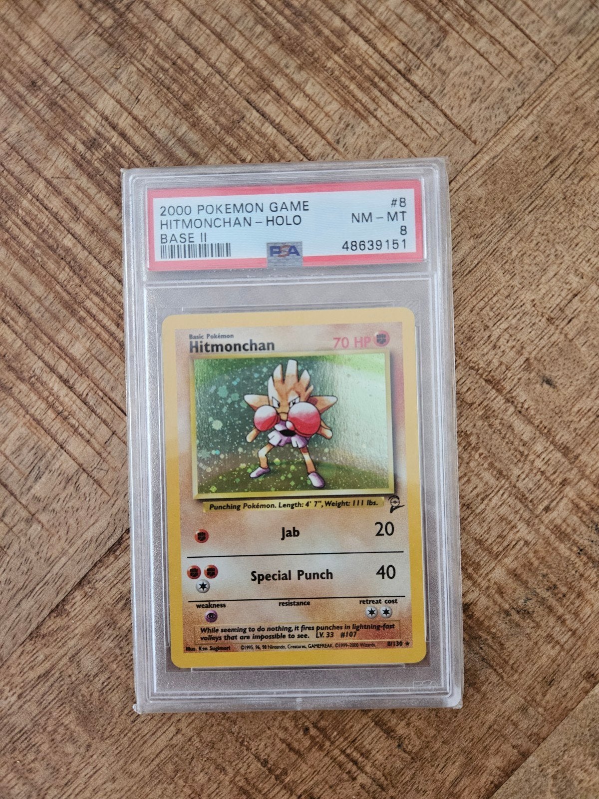 Hitmonchan Holo Base II PSA 8 Pokémon kaart, Ophalen of Verzenden, Zo goed als nieuw, Losse kaart