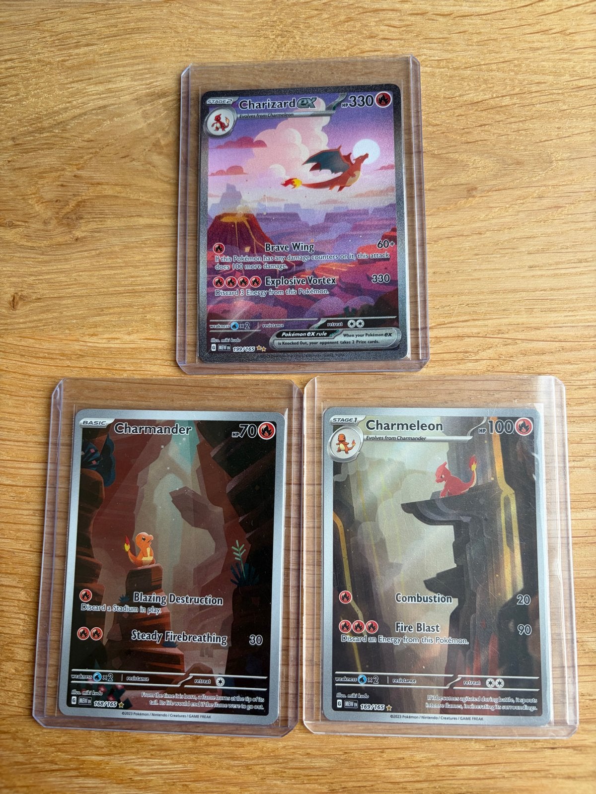 Pokémon 151 Charizard, Charmander, Charmeleon set, Ophalen, Zo goed als nieuw, Meerdere kaarten