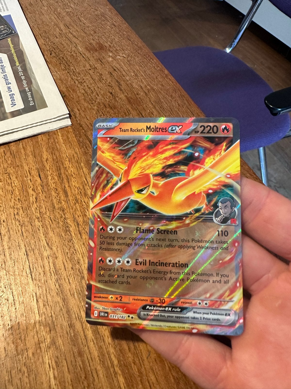 Team Rocket's Moltres ex Pokémon kaart, Ophalen of Verzenden, Zo goed als nieuw, Losse kaart, Foil